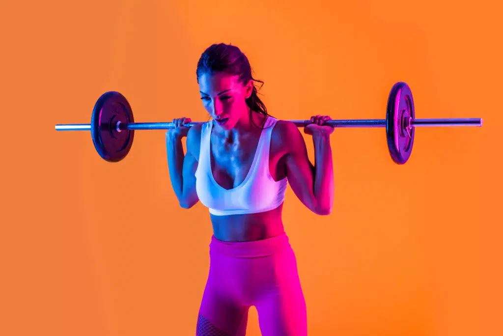 Neon sign in a gym used as a photo backdrop for social media posts